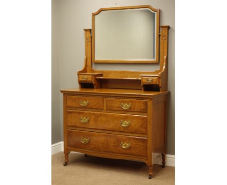 Edwardian oak dressing chest, raised shaped bevelled swing mirror with trinket drawers, two short and two long drawers, carve