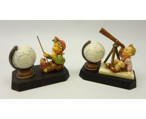 Two Goebel Hummel figurines, 'European Wanderer' & 'Star Gazer', H11cm, both on plinths with globes (2)    Condition Report  