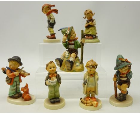 Seven Goebel Hummel figurines including; 'Doctor', 'Flower Vendor', 'Mountaineer', H13cm and four others (7)   Condition Repo