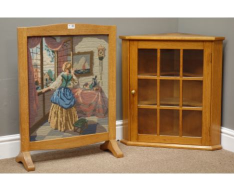 Craftsman made light oak corner cabinet enclosed by astragal glazed doors (W59cm, H63cm), and a light oak fire screen with ne