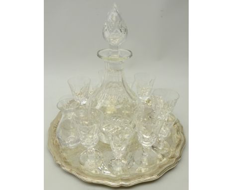 Stuart crystal decanter, six Stuart sherry glasses & six smaller glasses and a small Stuart vase on silver-plated tray with s