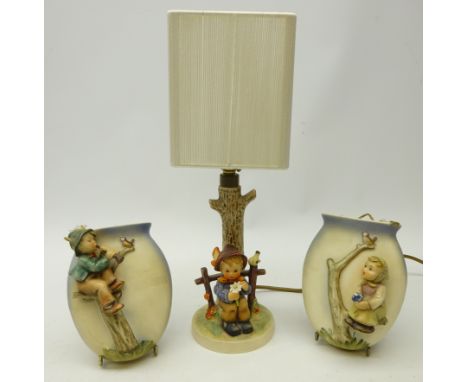 Goebel Hummel figural table lamp, 'Lady on Tree', c1968, H36cm and pair Goebel figural wall pockets (3)   Condition Report   