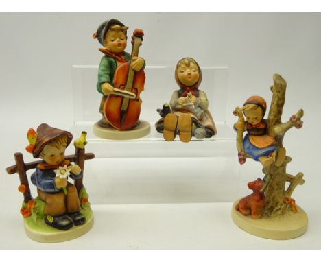 Four Goebel Hummel figurines, 'Boy with Cello', 'She Loves Me She Loves Me Not', 'Happy Pastime' and 'Out of Danger', H16cm (