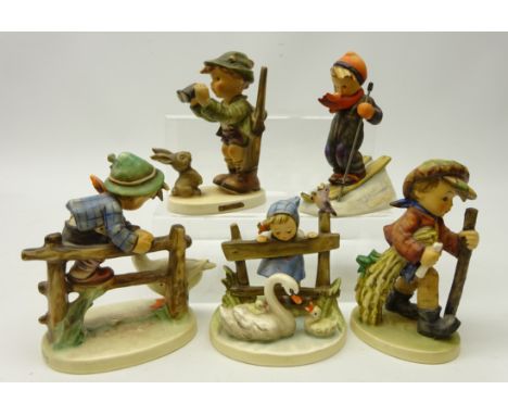 Five Goebel Hummel figurines including; 'Skier', 'Good Hunting', 'Barnyard Hero', H14cm and two others (5)   Condition Report