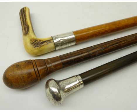 Ebony walking cane with silver top, hallmarked Birmingham 1920, Malaca walking cane with silver collar dated 1919, and a hard