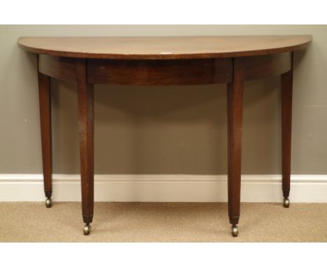 George III mahogany demi-lune console table, square tapering with brass cups and castors, W122cm, H72cm, D59cm