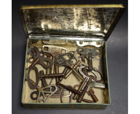 A tin of twenty steel bracket and mantel clock keys
