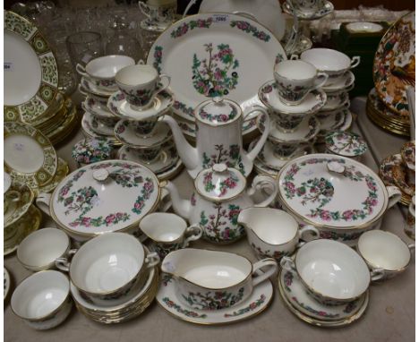 A eight setting Indian Tree pattern tea and dinner service, including two tureens, dinner, side, dessert plates, soup bowls a