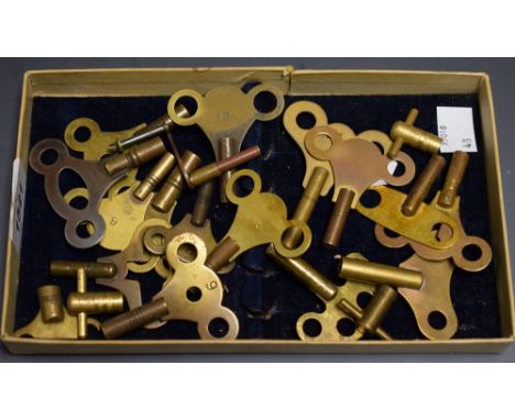 A box of twenty brass bracket and mantel clock keys