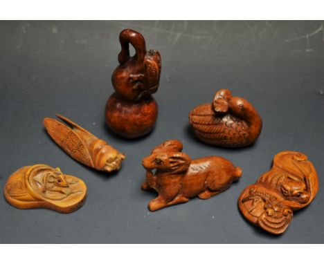 A carved hardwood grasshopper netsuke; others, mouse, bat, etc (6)