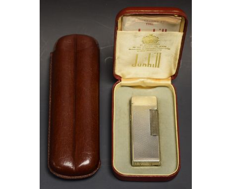 A Dunhill silver plated engine turned pocket lighter, boxed; a leather two division cigar case (2)