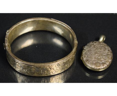 A silver locket and bangle