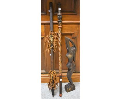 Tribal Art - a carved spiralling walking stick/club; a carved fertility goddess; a leather mounted spear (3)