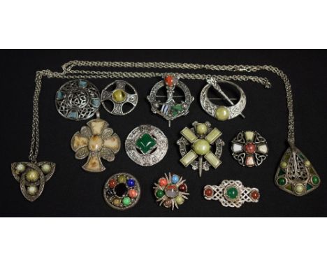 A Celtic style metal brooch, others set with glass and other polished stones; others similar, Miracle; etc