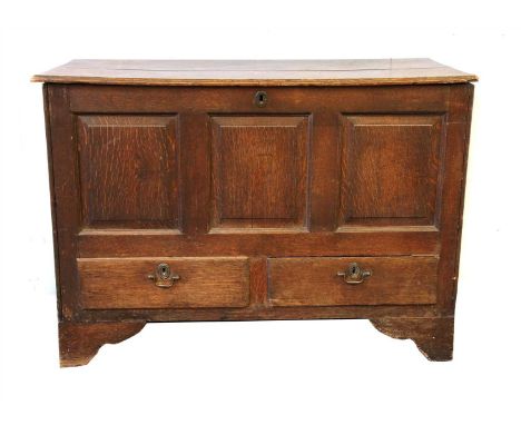 An oak mule chest, 18th century, with a lifting lid over two drawers and on bracket feet, 116cm wide, 54cm deep, 85cm high