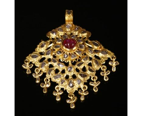 An Indian high carat gold, ruby and diamond pendant, with a later brooch fitting, with a ruby and diamond cluster to the cent