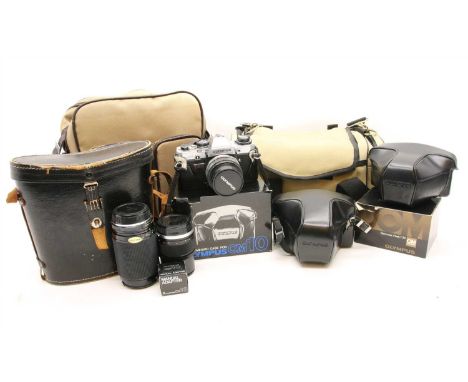 A collection of cameras and camera equipment, to include an Olympus OM10, an Olympus OM20 camera, lenses, flash, Tefnon lens 