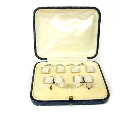 A cased mother of pearl dress set, including dress studs, collar studs ( one defective ), and cufflinks, all with rhomboid sh