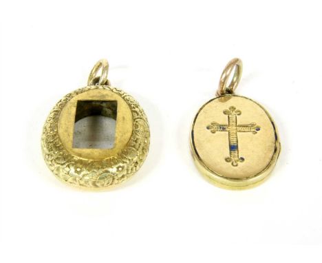 A gold enamel oval locket, with cross motif to one side and initials 'AEI' to the other, and an oval vacant locket, both test