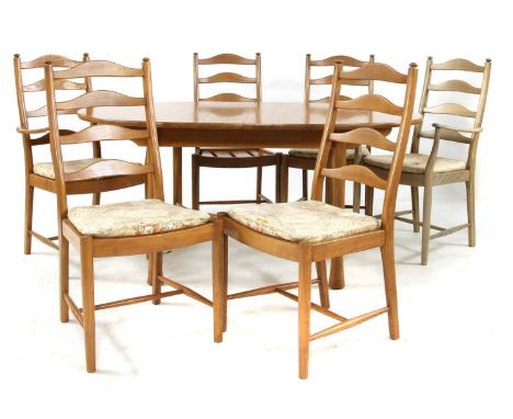 An Ercol elm dining table, with extra leaf, 213cm extended, 107cm wide, 75cm high, together with a set of six matching Ercol 