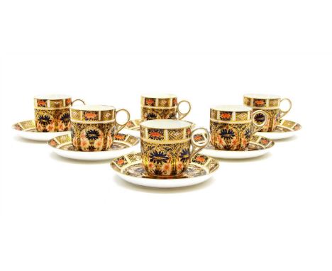 A set of six Crown Derby Imari pattern coffee cups and saucers
