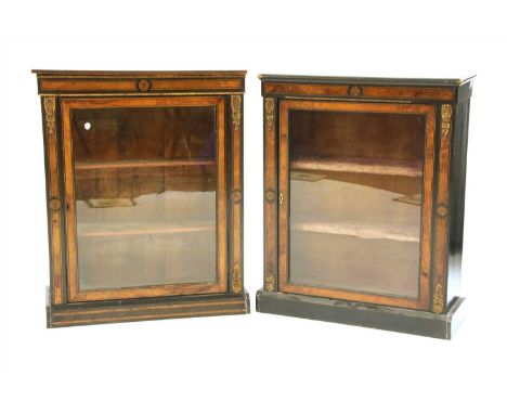 A pair of Victorian walnut and ebonised pier cabinets, with glazed door and gilt metal mount, 80cm wide, 36cm deep, 99cm high