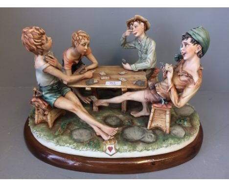 Model of 4 boys playing cards, signed Cortese 330 