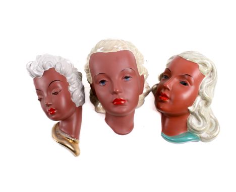 A group of three Goldscheider West German mid-century ceramic wall masks. Each with white glazed hair. Max. H21cm