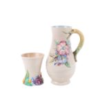Two Clarice Cliff items. Including a Newport Pottery My Garden Series jug and a Wilkinson Ltd vase.