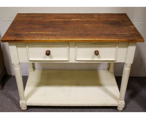 A painted wooden kitchen island unit. Having a plank top above two drawers with a shelf beneath, on turned legs and feet, H81
