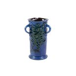 CH Brannam pottery cylinder three handle vase.