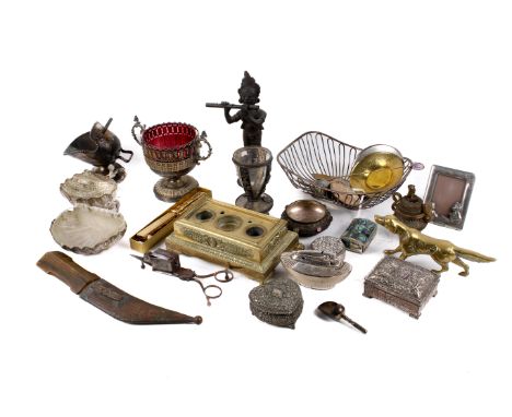A collection of assorted plated and brass items. Including a brass inkwell, a basket, etc.