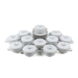 A set of Royal Copenhagen 'Fajance' soup bowls with covers and plates. Max.