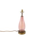 A mid-century red and white striped glass and brass table lamp.