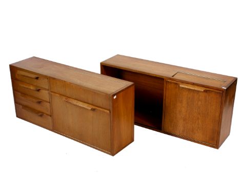 A pair of mid-century teak wall units. One consisting of four drawers flanked by a drop down cocktail section the other with 