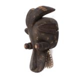 West African tribal carved wood Suaga type mask. With traces of red, white pigment.