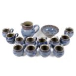 A Studio Art Pottery set of twelve mugs, a jug and a dish. With fish and octopus design. Max.