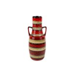 A two handled red and brown West German vase