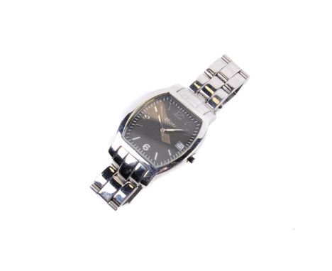 A lady's stainless steel DKNY wristwatch. Tonneau shaped case with mixed markings and date aperture at 3 o'clock. Quartz move