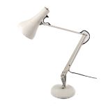 Anglepoise Lighting Ltd model 90 desk lamp. On a circular base.