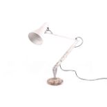 A mid-century Herbert Terry model '90' anglepoise desk lamp with round base.