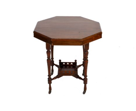 A mahogany octagonal table. On four turned legs with lower shelf plus stretchers, on ceramic casters, H72cm, diameter 69cm. 