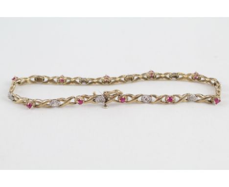 9ct gold diamond and ruby set Hugs and Kisses bracelet (4.1g)