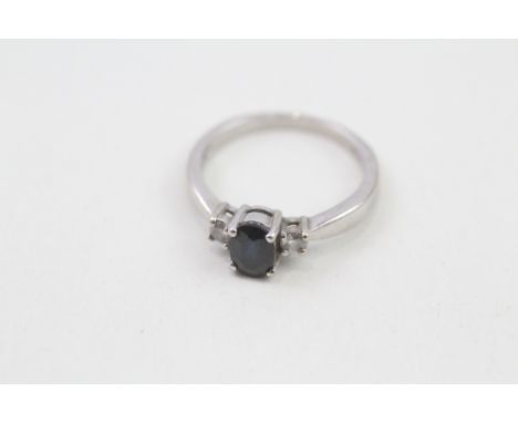 9ct white gold diamond &amp; sapphire three stone ring (1.9g). Ring size j/k