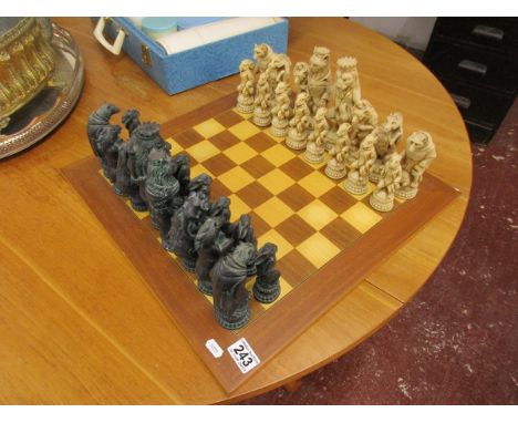 Ornate composition chess set with board