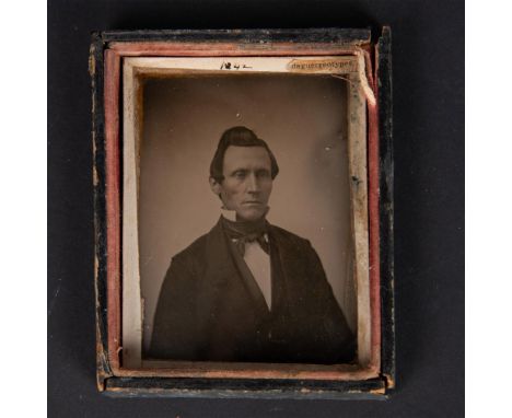 Antique daguerreotype glass plate in a wood frame that features a quarter length Portrait of John Baggs (1819-1895) dressed i