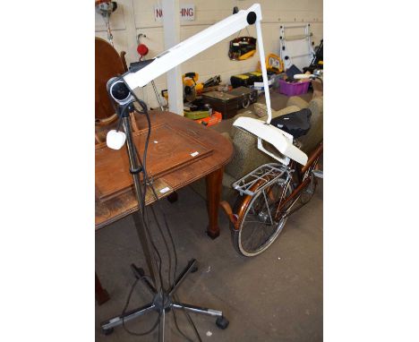 Floor standing magnifier light with adjustable arm