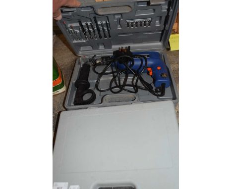 Electric drill and a case of assorted tools