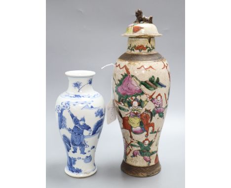 A Chinese famille rose crackleglaze vase and cover, together with a Chinese blue and white figural vase bearing Kangxi mark, 