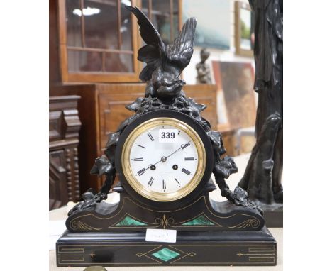 A Victorian malachite black slate mantel clock, with spelter bird surmount